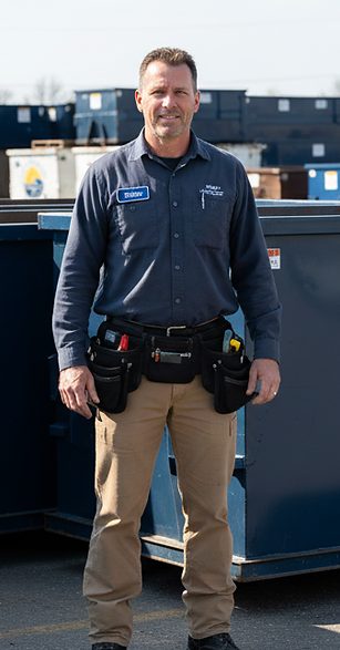 Paul, Monocacy Dumpster fleet supervisor, with a container